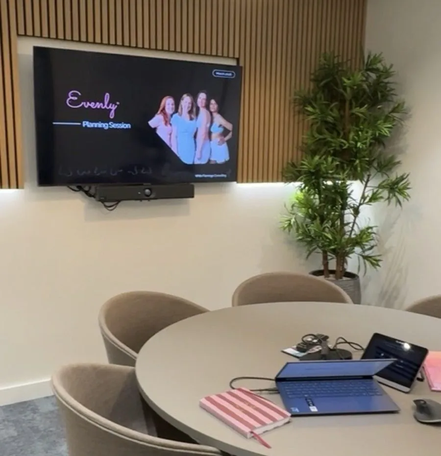 A client planning session displayed on a screen in a meeting room